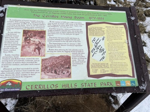 Informational sign about the Cerrillos Mining Boom (1879-1884) at Cerrillos Hills State Park, featuring historical details and maps.