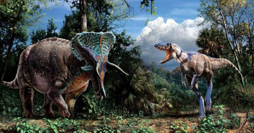 A colorful dinosaur and a large, horned dinosaur stand in a lush prehistoric landscape with trees and clouds.