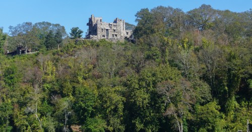 a castle sits high on a hill at gillette castle state park in east haddam ct