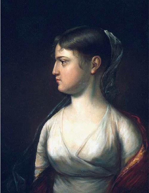 Profile portrait of a woman with dark hair, wearing a white dress and a red shawl, set against a dark background.