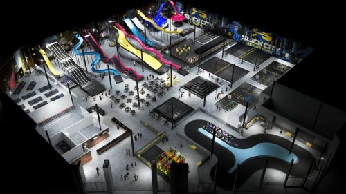 Aerial view of an indoor amusement park featuring slides, climbing areas, and various activity zones.