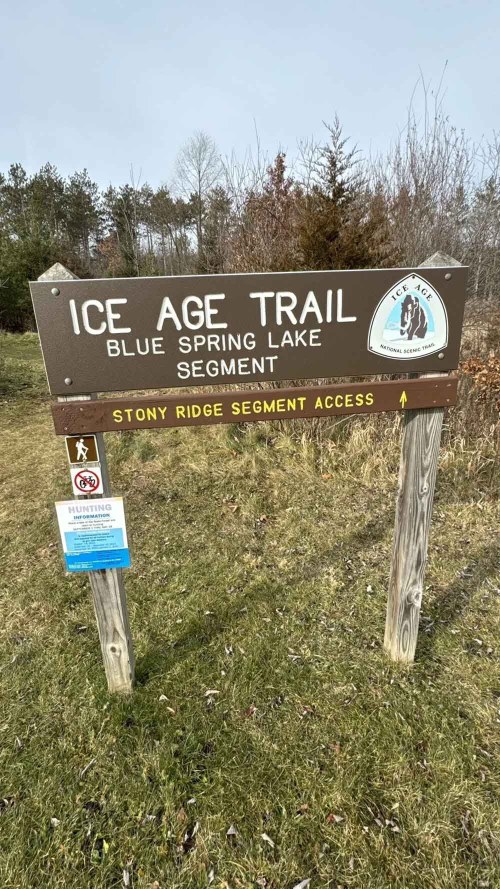 Sign for the Ice Age Trail, Blue Spring Lake Segment, with information about access and trail details.