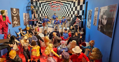 A vibrant display of various action figures and dolls in a colorful, surreal room with checkered walls and posters.
