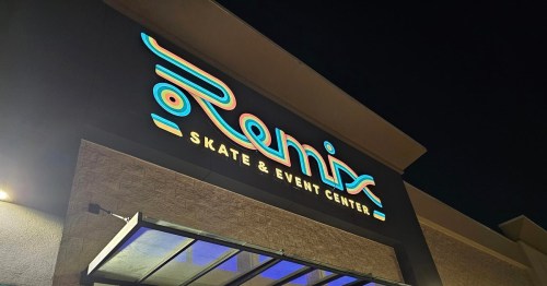 Neon sign for "Remix Skate & Event Center" illuminated at night.