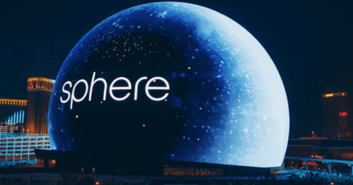 A large illuminated dome displays the word "sphere" against a starry night sky backdrop.