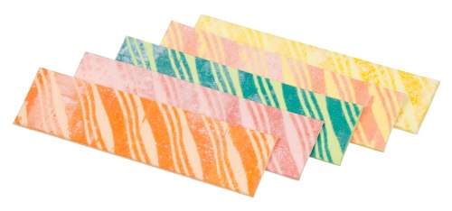 Colorful striped candy bars in orange, pink, green, and yellow arranged in a row on a white background.