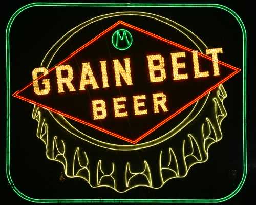 Neon sign for Grain Belt Beer, featuring bright red and yellow lettering on a dark background.