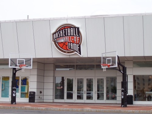 Exterior of the Basketball Hall of Fame featuring two basketball hoops and a prominent logo above the entrance.