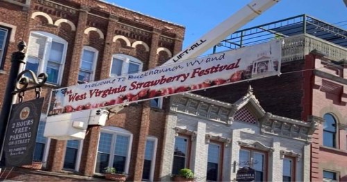Banner welcoming visitors to the West Virginia Strawberry Festival, displayed above a street in Buckhannon, WV.