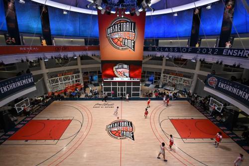 Aerial view of a basketball court at the Hall of Fame, featuring a large display for the Class of 2022 enshrinement.