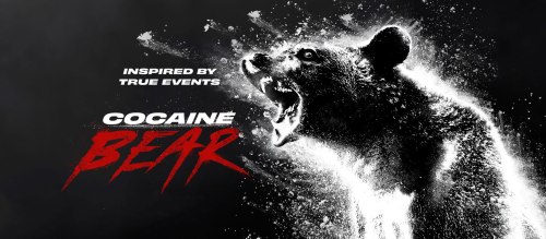 A fierce bear with a dramatic expression, surrounded by a cloud of white powder, with the title "Cocaine Bear" prominently displayed.