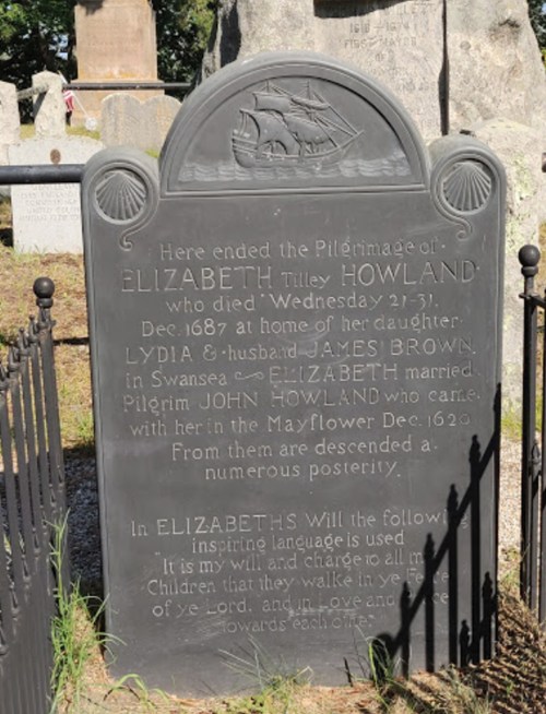 Gravestone of Elizabeth Tilley Howland, detailing her life and family connections, set in a cemetery.