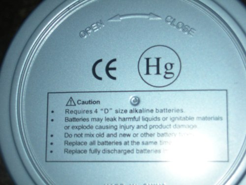 Label on the bottom of a device, detailing battery requirements and safety precautions.