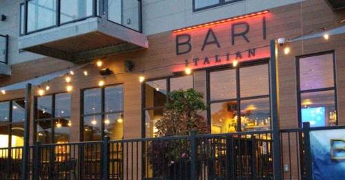 Exterior of Bari Italian restaurant, featuring warm lighting and a welcoming atmosphere.