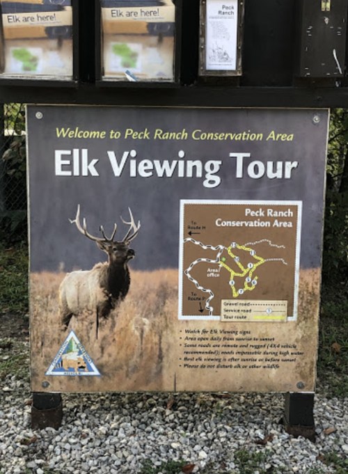 Sign for Peck Ranch Conservation Area featuring an elk and a map for the Elk Viewing Tour.
