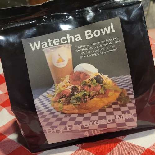 A package of Watecha Bowl frybread mix, featuring a colorful design and text about its community-focused origins.