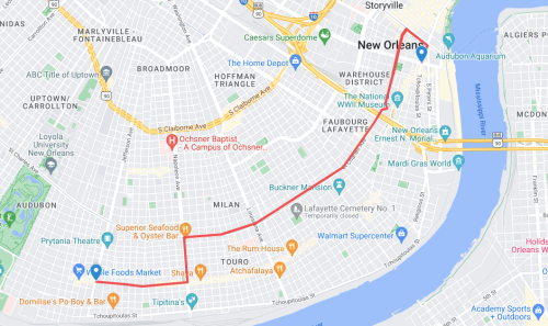 Map of New Orleans highlighting the Warehouse District and nearby landmarks, with a red line indicating a route.