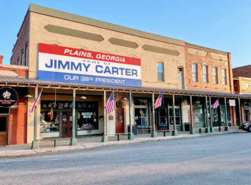 Historic building in Plains, Georgia, featuring a large sign about Jimmy Carter, the 39th President of the United States.