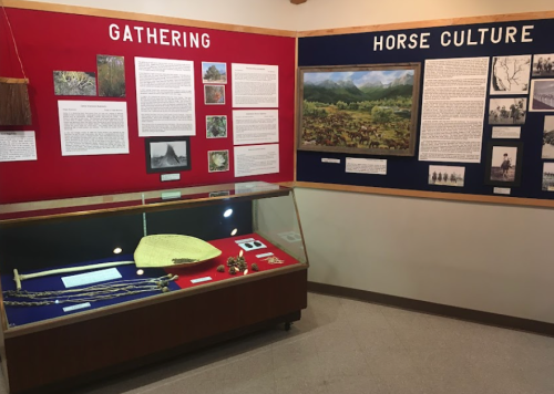 Exhibit featuring two displays: "Gathering" and "Horse Culture," with artifacts and informational panels.