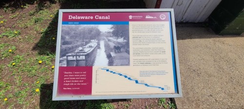 Sign about the Delaware Canal (1831-1932) featuring historical images and information about its significance and features.