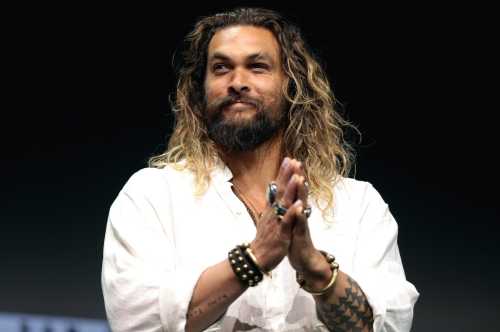 Jason Mamoa, a famous celebrity from Hawaii wearing a white shirt