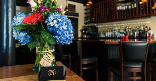 the cozy wood interios and bar area of roberto's restaurant and cafe in rhode island