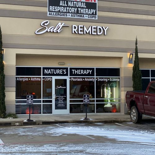 Exterior of a wellness center named "Salt Remedy," offering therapies for allergies, asthma, and other conditions.