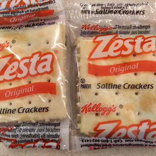 Two packages of Zesta Original Saltine Crackers, featuring the Kellogg's logo and a clear plastic wrapper.
