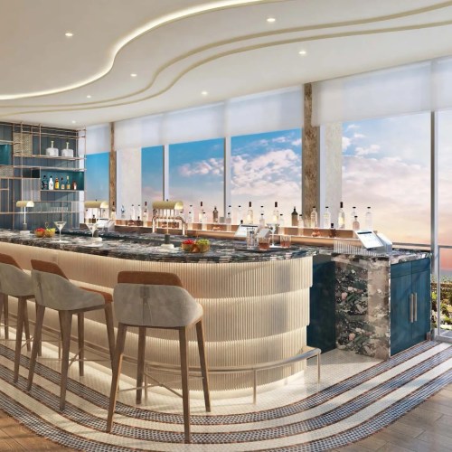 A modern bar with a sleek design, featuring high stools, a marble counter, and large windows showcasing a scenic view.