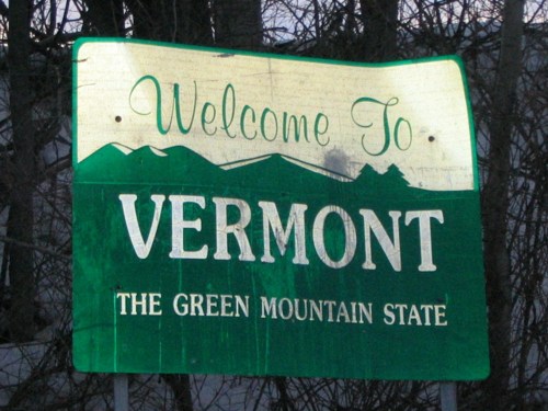 Welcome sign for Vermont, featuring the text "The Green Mountain State" with a mountain silhouette in the background.