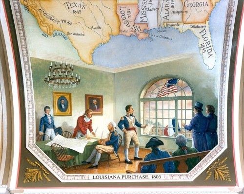 Mural depicting the Louisiana Purchase of 1803, featuring historical figures in a meeting with a map in the background.