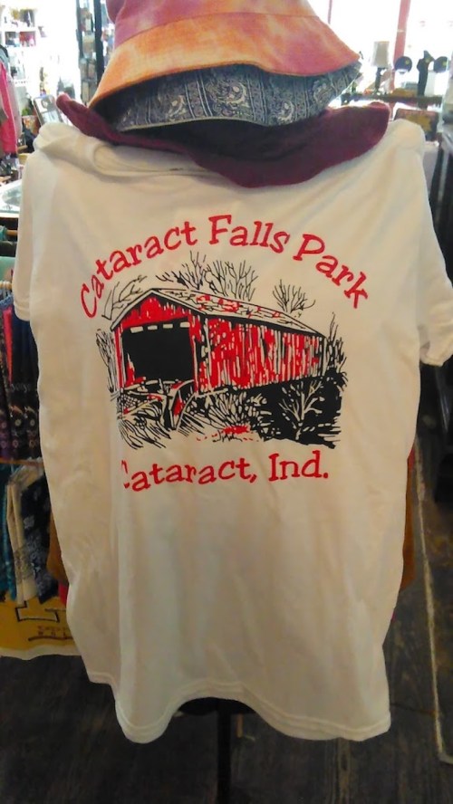 White t-shirt featuring a graphic of a red barn and text: "Cataract Falls Park, Cataract, Ind."