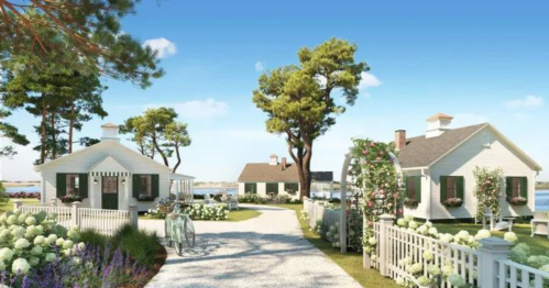 Charming coastal cottages surrounded by greenery and flowers, with a clear blue sky and a pathway leading to the water.