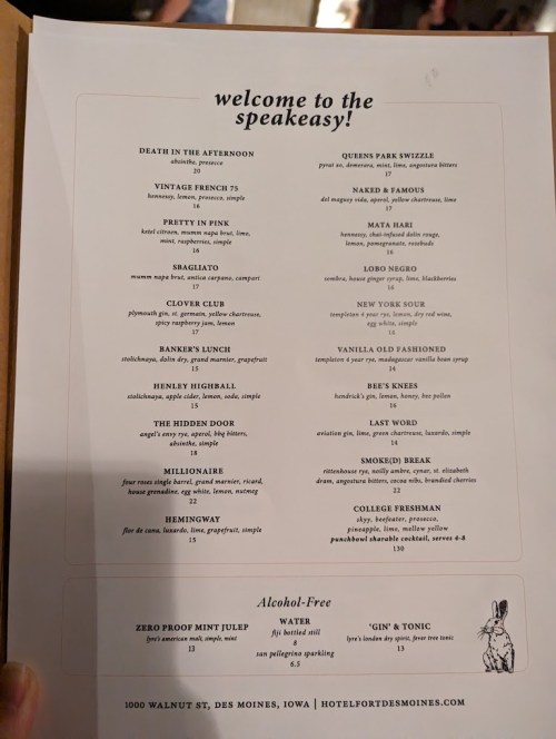 Menu from a speakeasy featuring cocktails, food items, and alcohol-free options. Includes various drink names and descriptions.