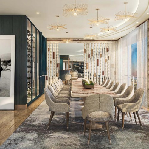 Modern dining room with a large table, stylish chairs, and elegant lighting, featuring a wine display and scenic views.