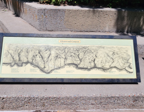 A detailed map of Glenwood Canyon displayed on a stone surface, showing the river and surrounding terrain.