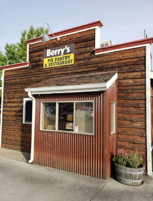 Exterior of Berry's Pie Pantry & Restaurant, featuring a wooden facade and a sign above the window.