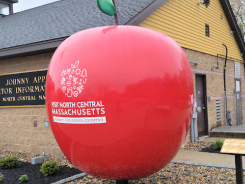 A large red apple sculpture outside the Johnny Appleseed Visitor Information Center in North Central Massachusetts.