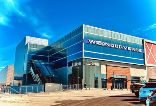 A modern building with large glass windows, featuring a sign for "Wonderverse" and an entrance to L.L. Bean.