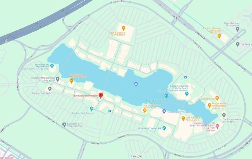 Map of a resort area featuring a lake, various attractions, and nearby roads. Key locations are marked.