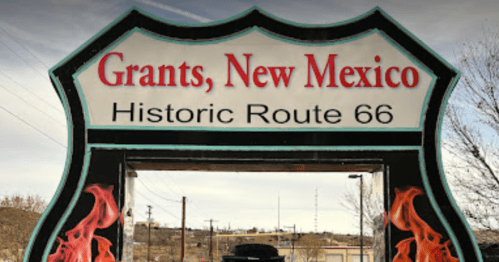 Sign welcoming visitors to Grants, New Mexico, featuring "Historic Route 66" with decorative flames.