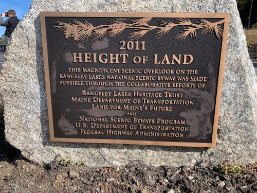 A bronze plaque commemorating the 2011 Height of Land overlook on the Rangely Lakes National Scenic Byway.