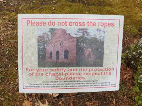 Sign warning against crossing ropes, emphasizing safety and respect for the chapel's boundaries.