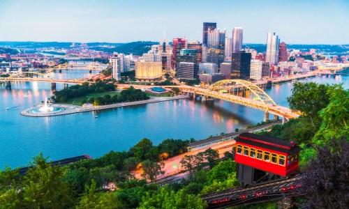 Beautiful twilight view of Pittsburgh, Pennsylvania, USA, taken on August 20, 2017, showing the city skyline and bridges illuminated against the evening sky.
