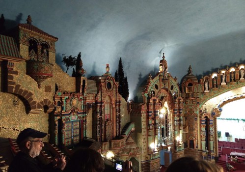 Interior view of a beautifully ornate theater with colorful decorations and intricate architectural details.