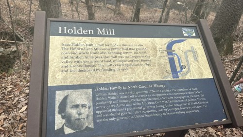 Sign about Holden Mill, detailing its history and significance in North Carolina, with information on the Holden family.