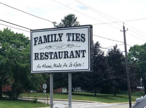 Sign for "Family Ties Restaurant," established in 2002, with the tagline "As Home Made As It Gets!"