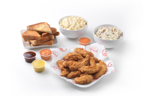 A platter of crispy fried chicken tenders with dipping sauces, served alongside toast, macaroni and cheese, and coleslaw.