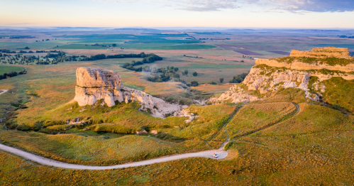 aerial shot of Courthouse and Jail Rocks and a roa leading up to them in Nebraska
