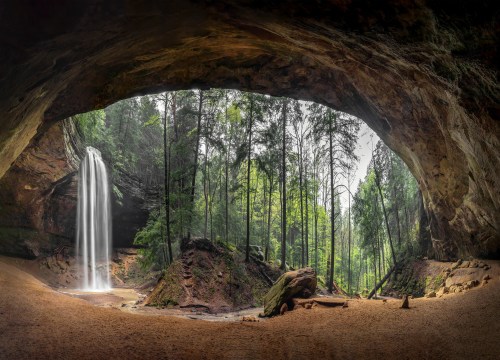 Panoramic view inside vast Ash Cave with waterfall, Hocking Hills, OH